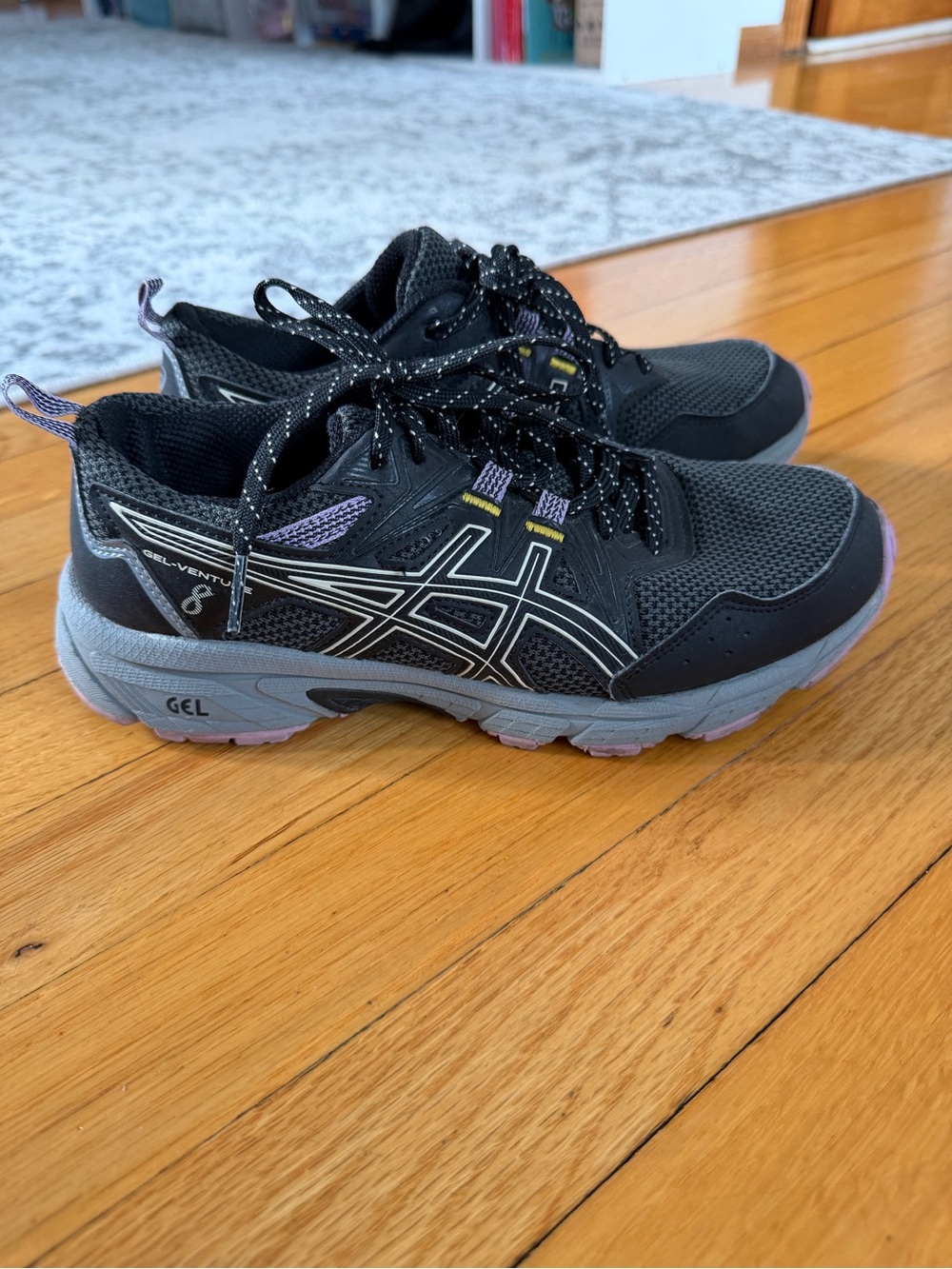 Asics Black and Gray Trail Running Sneakers with Purple Highlights